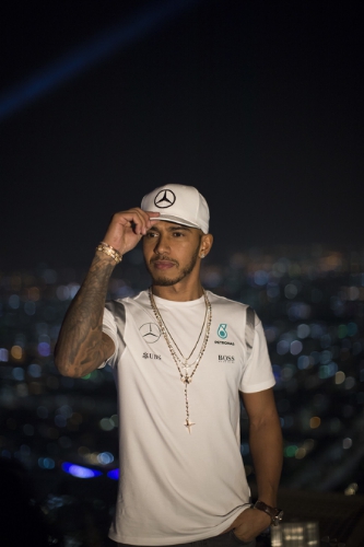 Mercedes AMG Petronas Formula 1 driver Lewis Hamilton stands on the highest active helipad in the Middle East (255m) at The St Regis Hotel, in Abu Dhabi, UAE, ahead of the Abu Dhabi Grand Prix title decider on Saturday, November 26, 2016. (PRNewsFoto/The St. Regis Abu Dhabi)